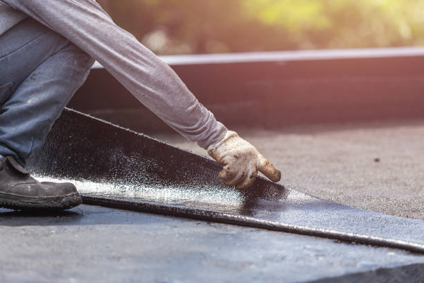 Professional Basement Waterproofing technician working in Burtonsville, MD